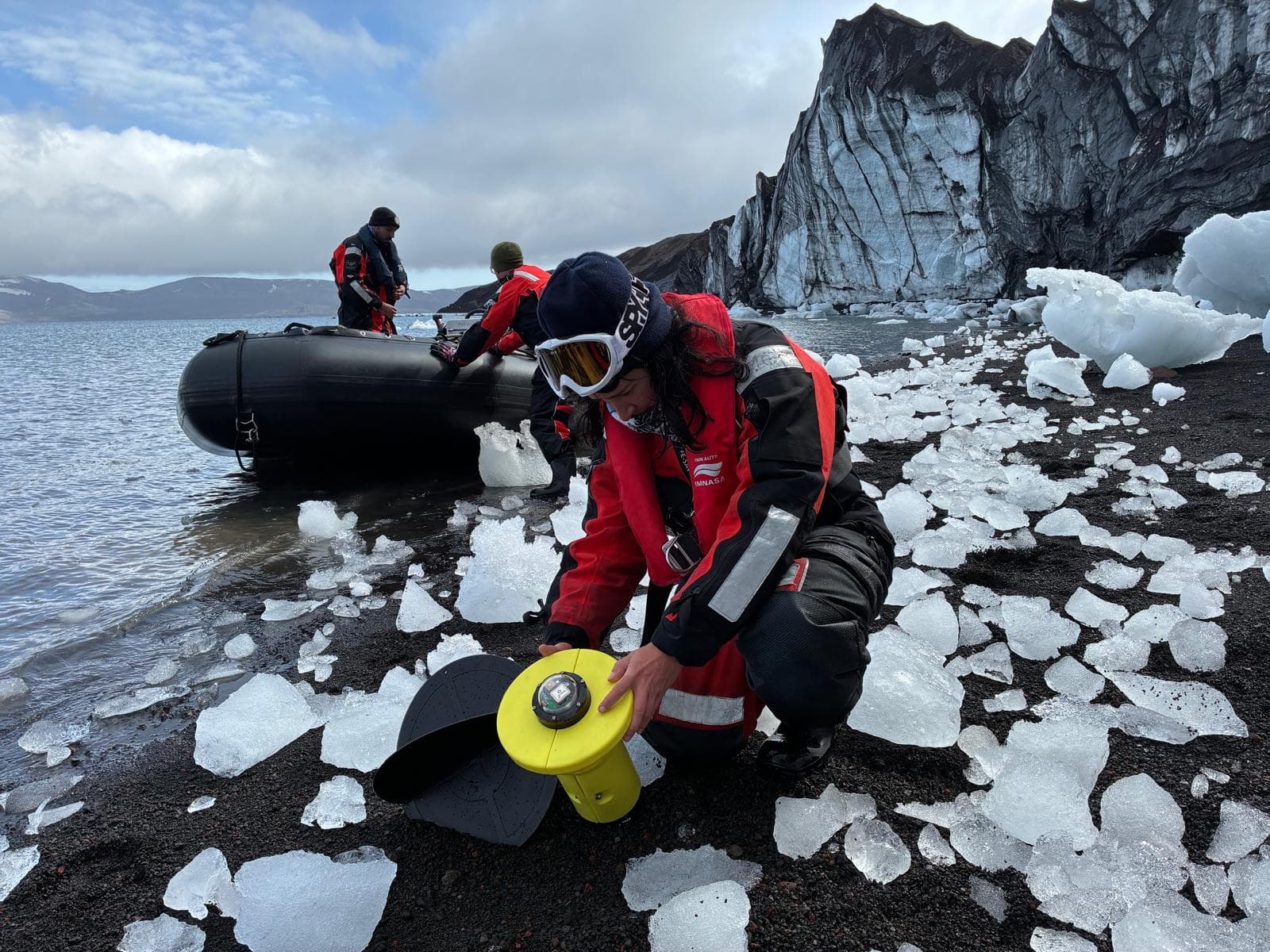 Deploying an instrument on a volcanic beach in Antarctica