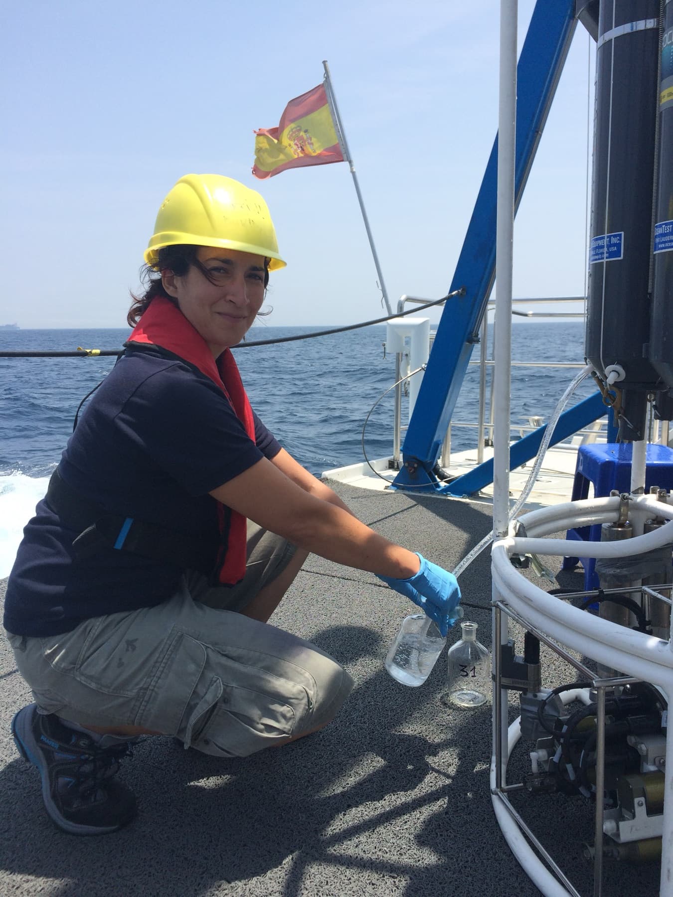 Sampling water from the rosette on deck during a marine research expedition