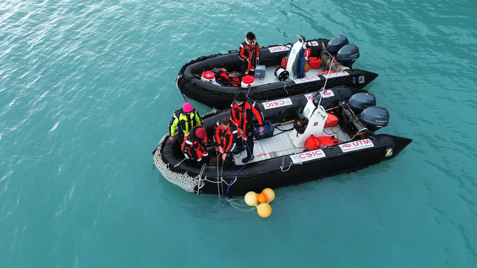Aerial view of zodiacs over Antarctic waters (CSIC–UTM operations in the Southern Ocean)